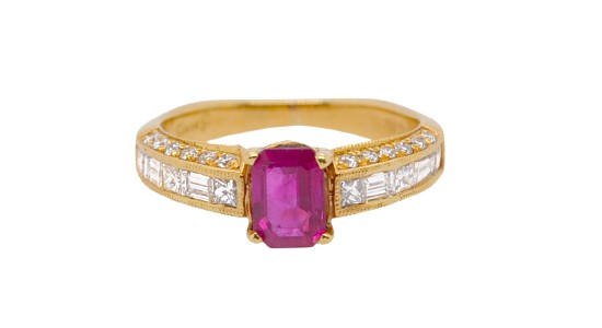 a yellow gold fashion ring with a ruby center stone and diamond accent stones